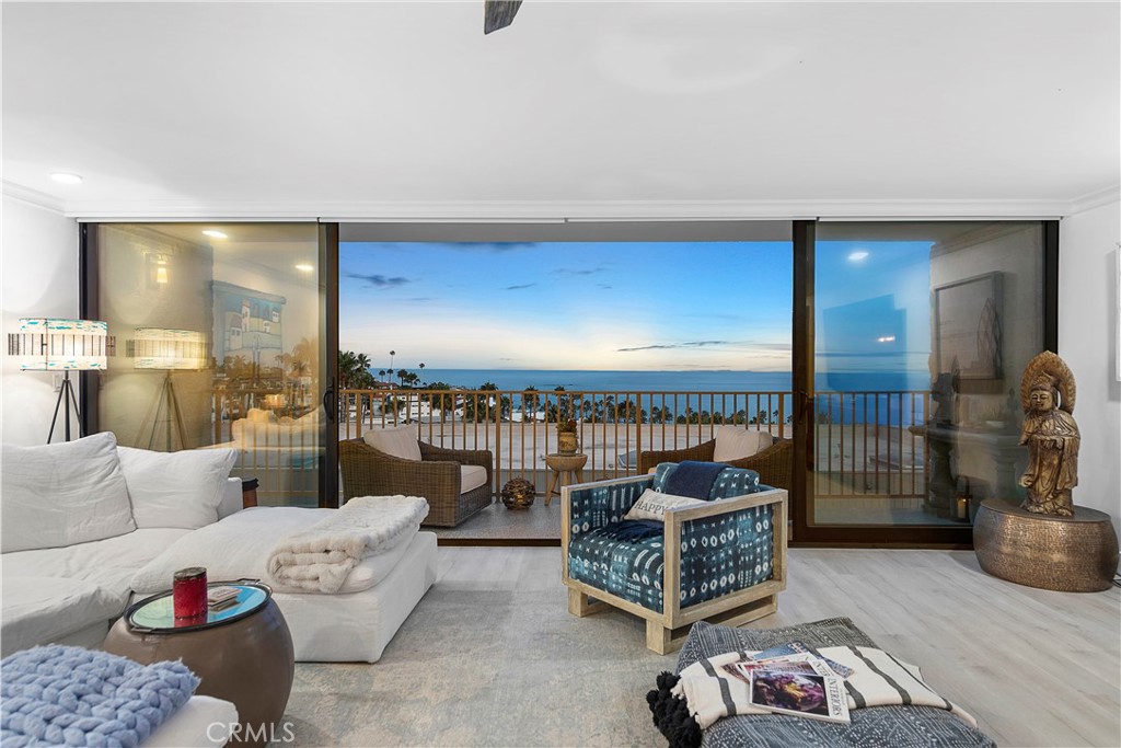 405 Avenida Granada, Unit 312 San Clemente, CA 92672 - Photo 14 of 43 a living room with furniture and a large window