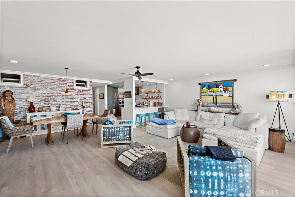 405 Avenida Granada, Unit 312 San Clemente, CA 92672 - Photo 16 of 43 a living room with furniture and a large window