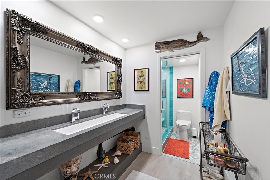 405 Avenida Granada, Unit 312 San Clemente, CA 92672 - Photo 19 of 43 a bathroom with a sink mirror and vanity