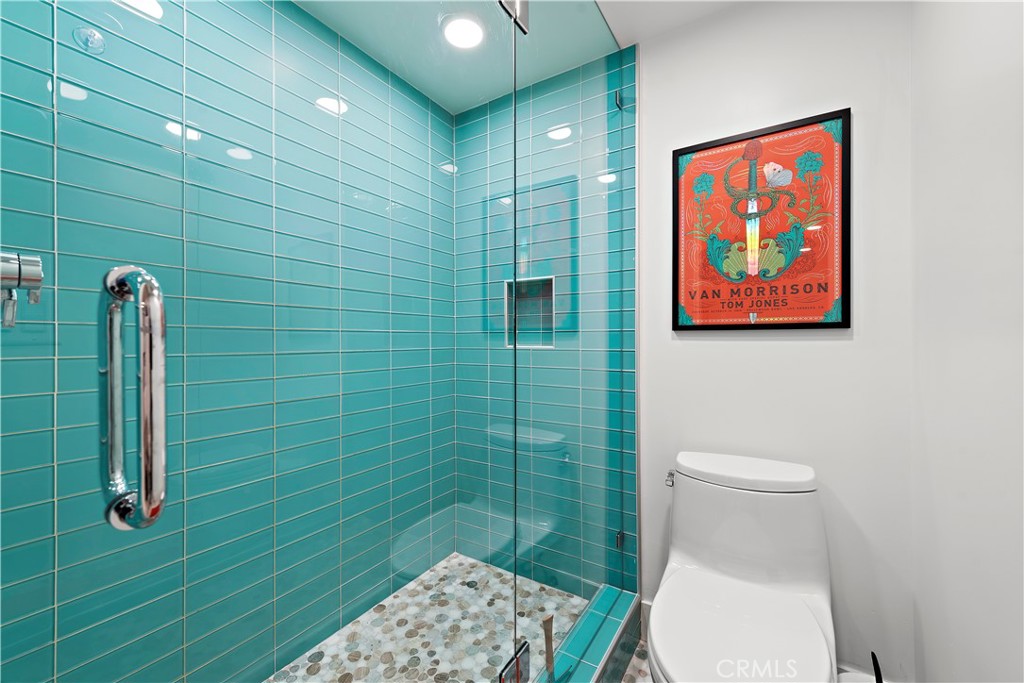 405 Avenida Granada, Unit 312 San Clemente, CA 92672 - Photo 20 of 43 a bathroom with a toilet and a shower