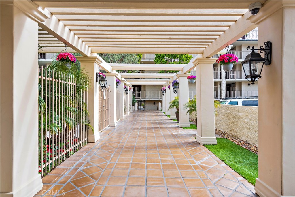 405 Avenida Granada, Unit 312 San Clemente, CA 92672 - Photo 29 of 43 a view of a porch and garage