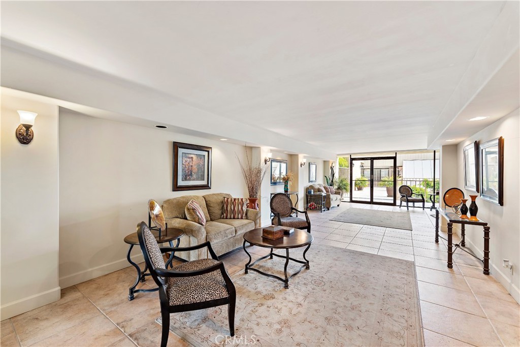 405 Avenida Granada, Unit 312 San Clemente, CA 92672 - Photo 31 of 43 a living room with furniture and a table