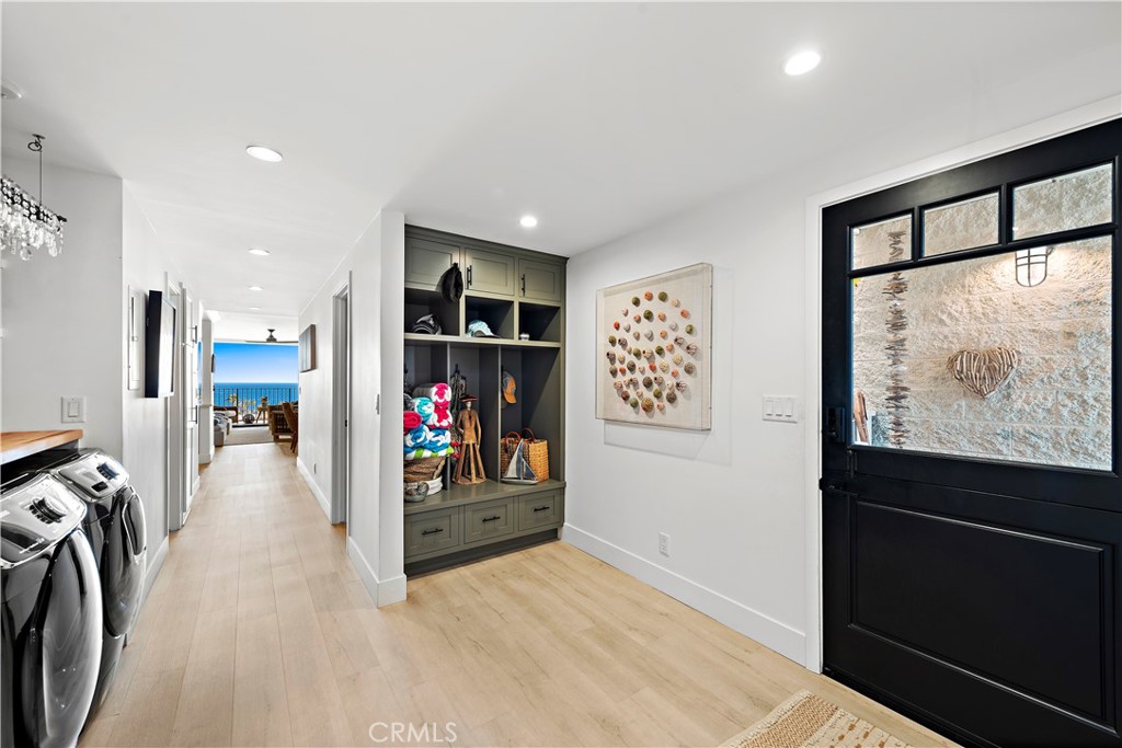 405 Avenida Granada, Unit 312 San Clemente, CA 92672 - Photo 4 of 43 a view of a hallway with wooden floor and furniture