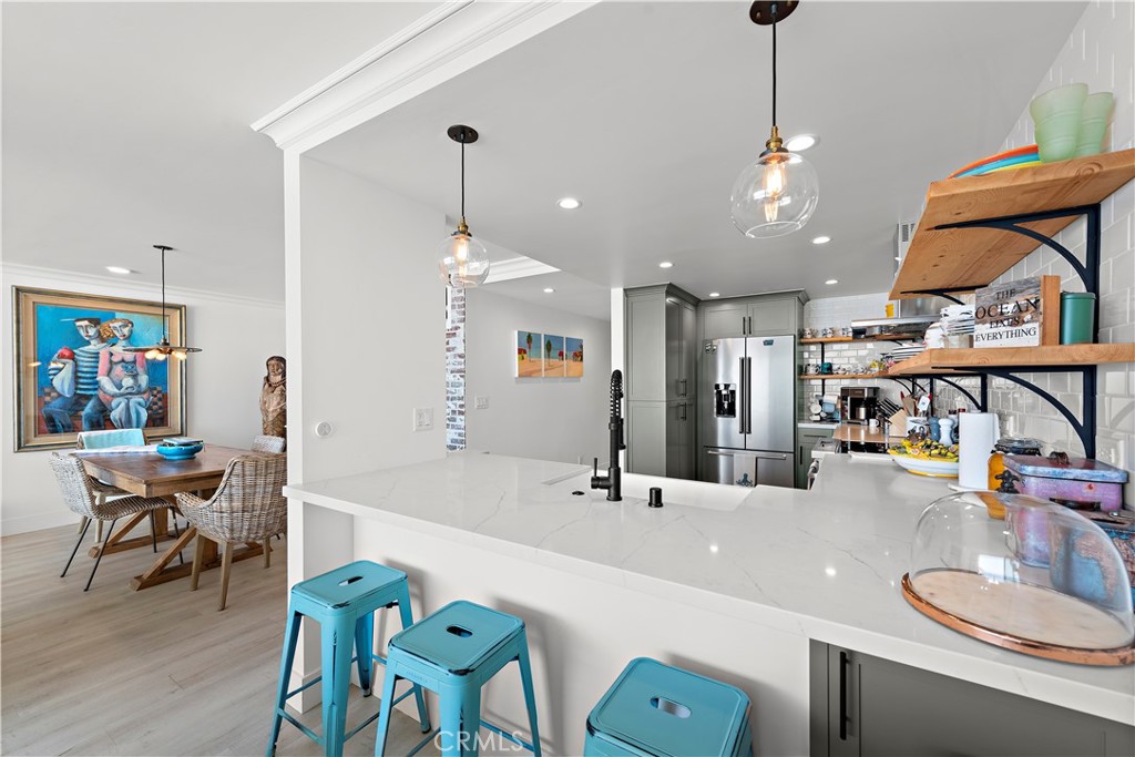 405 Avenida Granada, Unit 312 San Clemente, CA 92672 - Photo 8 of 43 a large kitchen with a table and chairs
