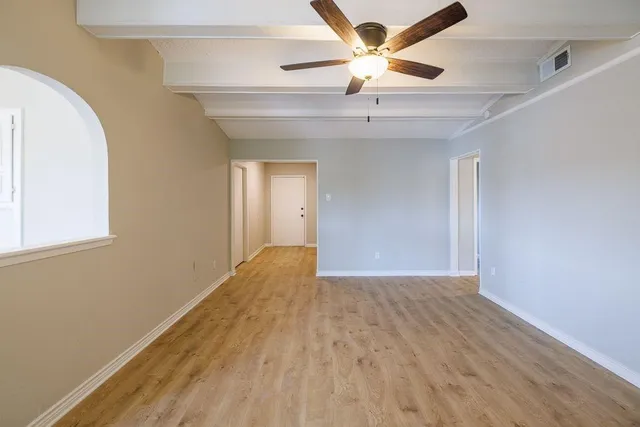 a view of a kitchen with center island and stainless steel appliances