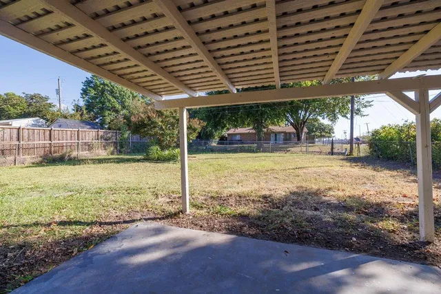 a view of a swimming pool with an outdoor space