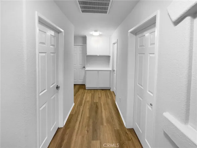 a view of a bathroom from a hallway