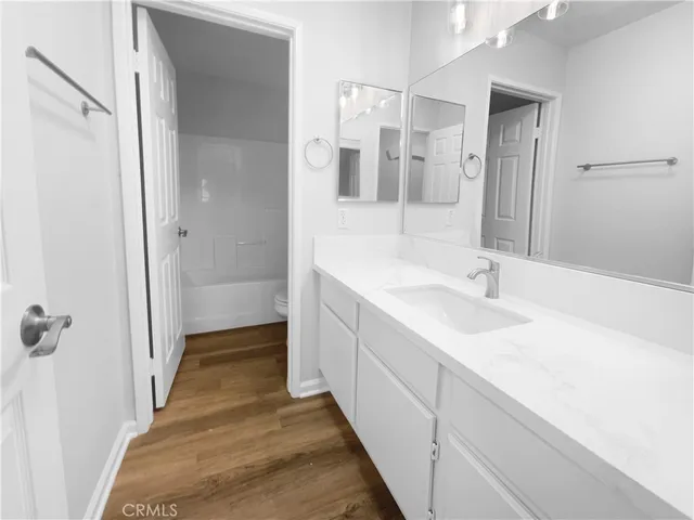 a bathroom with a sink and mirror