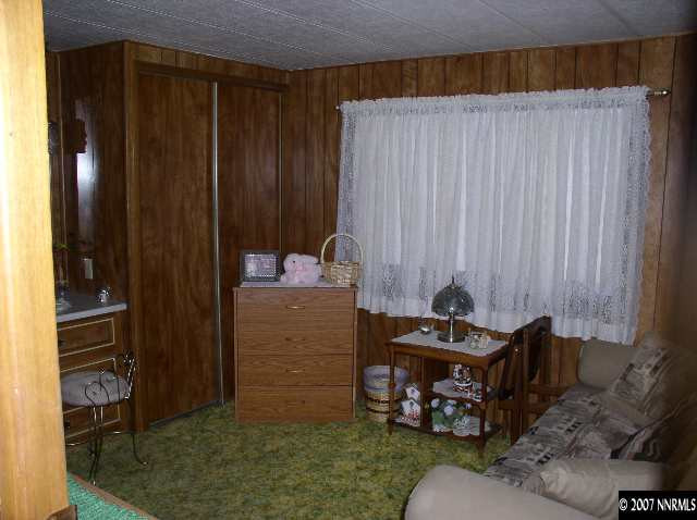 15075 Rhyolite Circle Reno, NV 89521 - Photo 4 of 9 a room with furniture and a gate