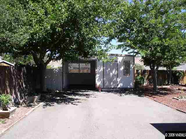 15075 Rhyolite Circle Reno, NV 89521 - Photo 9 of 9 a view of house with yard and tree s