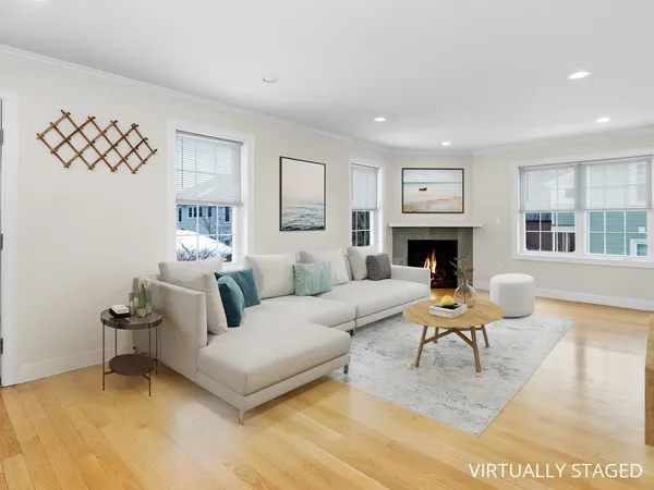 a living room with furniture and a fireplace