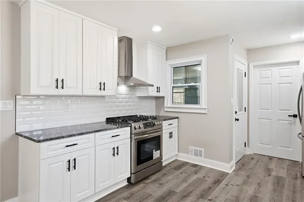 a view of front door with wooden floor