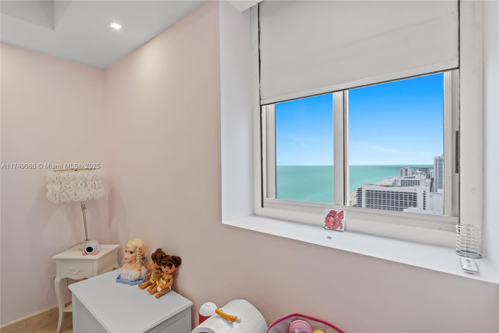 4775 Collins Avenue, Unit 3505 Miami Beach, FL 33140 - Photo 43 of 73 a bathroom with a window sink and mirror