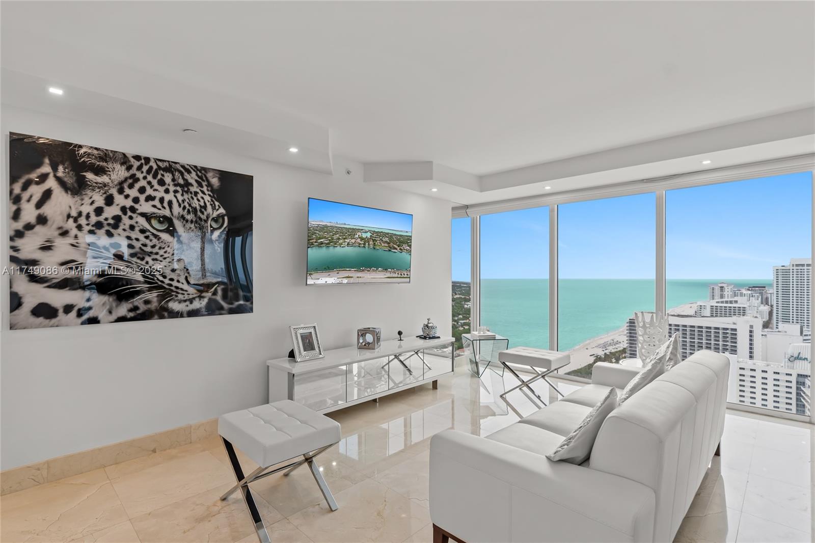4775 Collins Avenue, Unit 3505 Miami Beach, FL 33140 - Photo 5 of 73 a living room with furniture and a large window