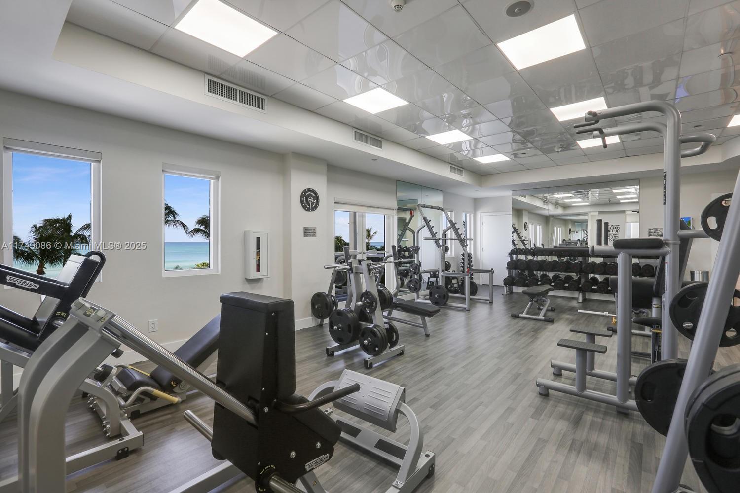 4775 Collins Avenue, Unit 3505 Miami Beach, FL 33140 - Photo 64 of 73 a view of a room with gym equipment
