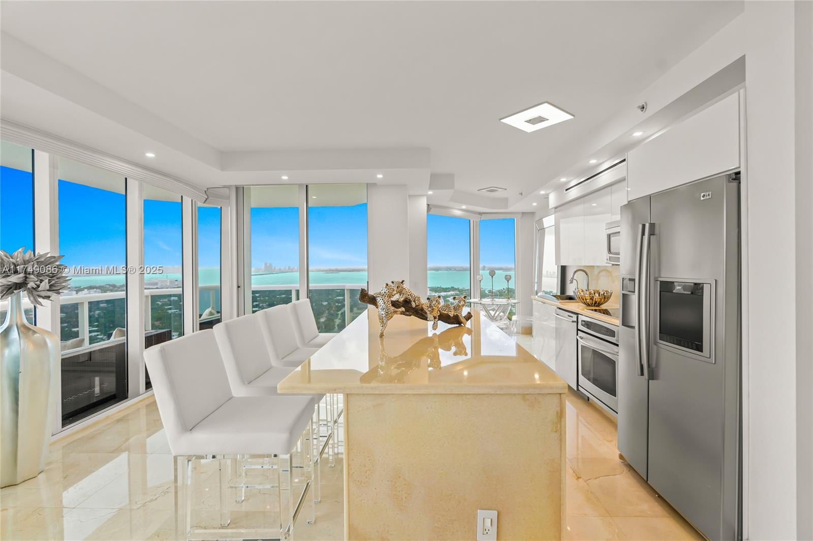 4775 Collins Avenue, Unit 3505 Miami Beach, FL 33140 - Photo 8 of 73 a view of a kitchen with furniture and large window