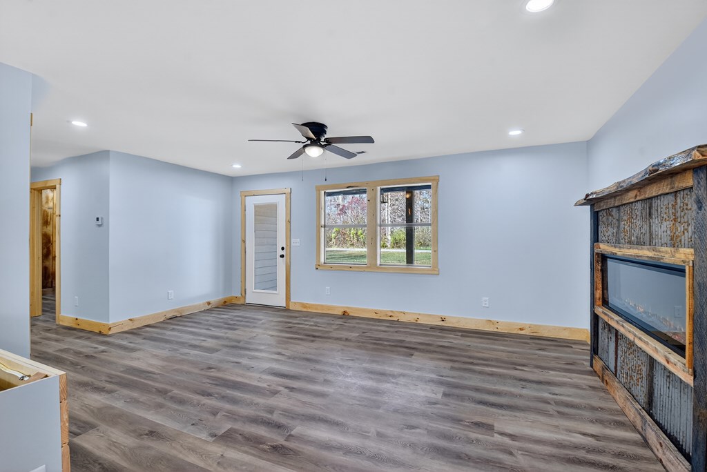 569 No 20 Mine Road McCaysville, GA 30555 - Photo 14 of 29 a view of an empty room with window and wooden floor