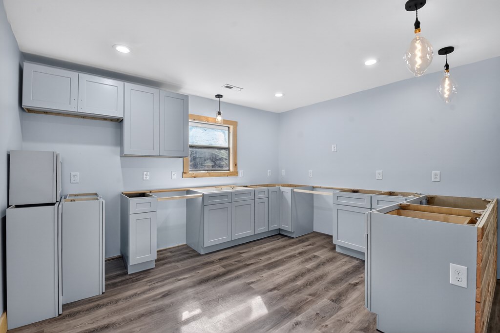 569 No 20 Mine Road McCaysville, GA 30555 - Photo 16 of 29 a kitchen with white cabinets and white appliances