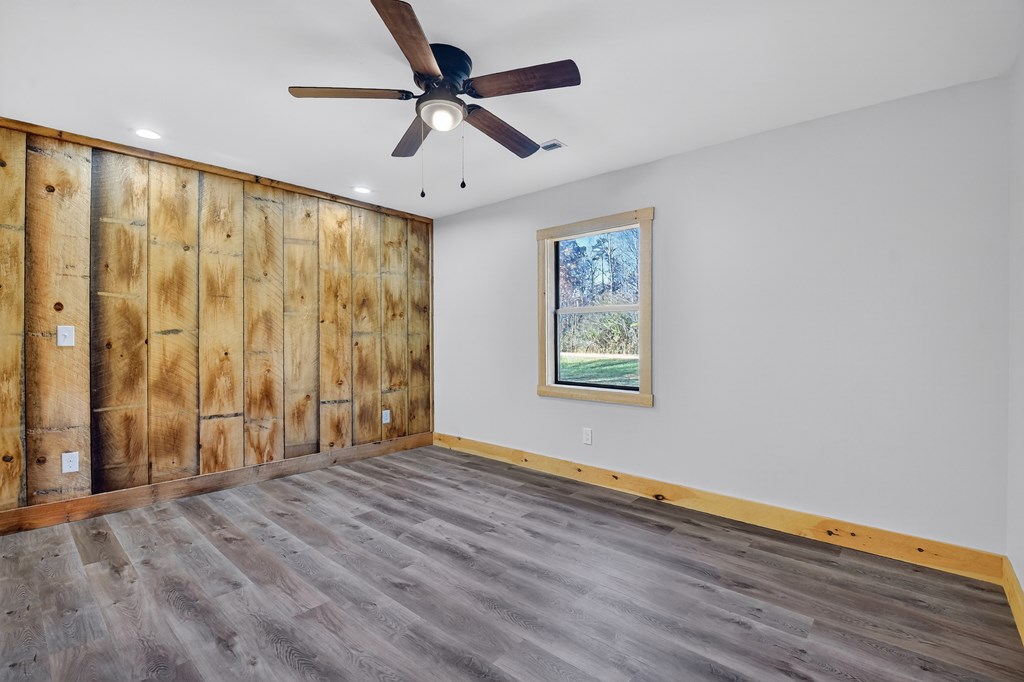 569 No 20 Mine Road McCaysville, GA 30555 - Photo 18 of 29 wooden floor in an empty room with a window