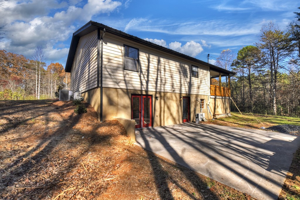 569 No 20 Mine Road McCaysville, GA 30555 - Photo 25 of 29 a view of a house with a backyard