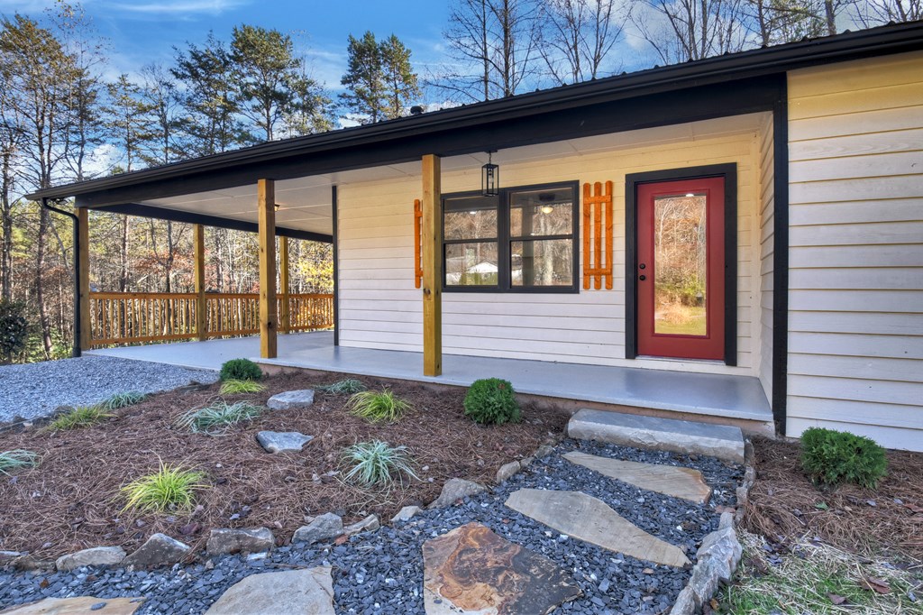 569 No 20 Mine Road McCaysville, GA 30555 - Photo 8 of 29 a front view of a house with garden