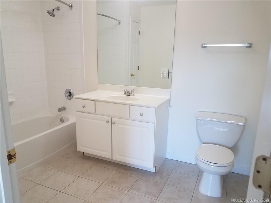 19 Isaacs Street, Unit 406 Norwalk, CT 06850 - Photo 11 of 13 a bathroom with a sink a toilet and bathtub