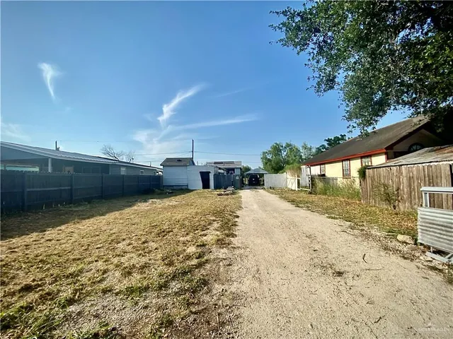 a view of swimming pool with a yard