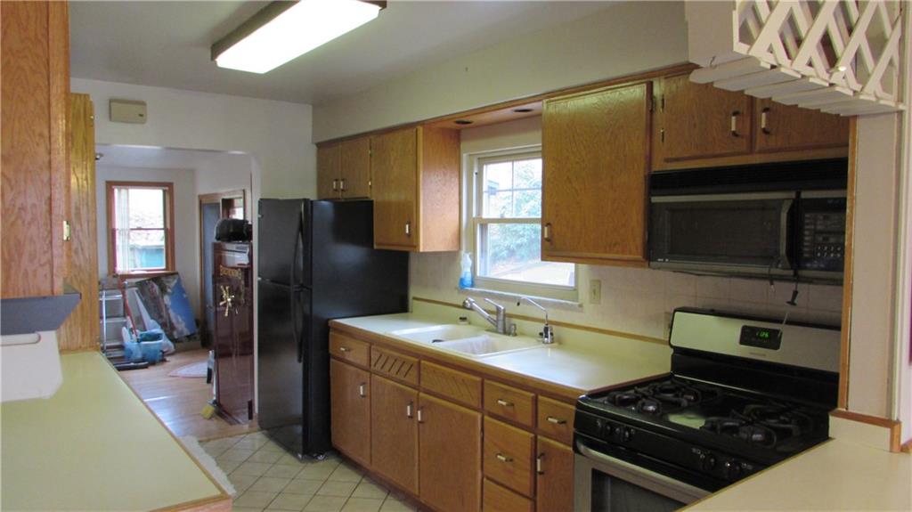 1396 Riverview Road Crescent, PA 15046 - Photo 8 of 25 New Refrigerator. This kitchen is also equipped with a Gas Stove and Microwave.