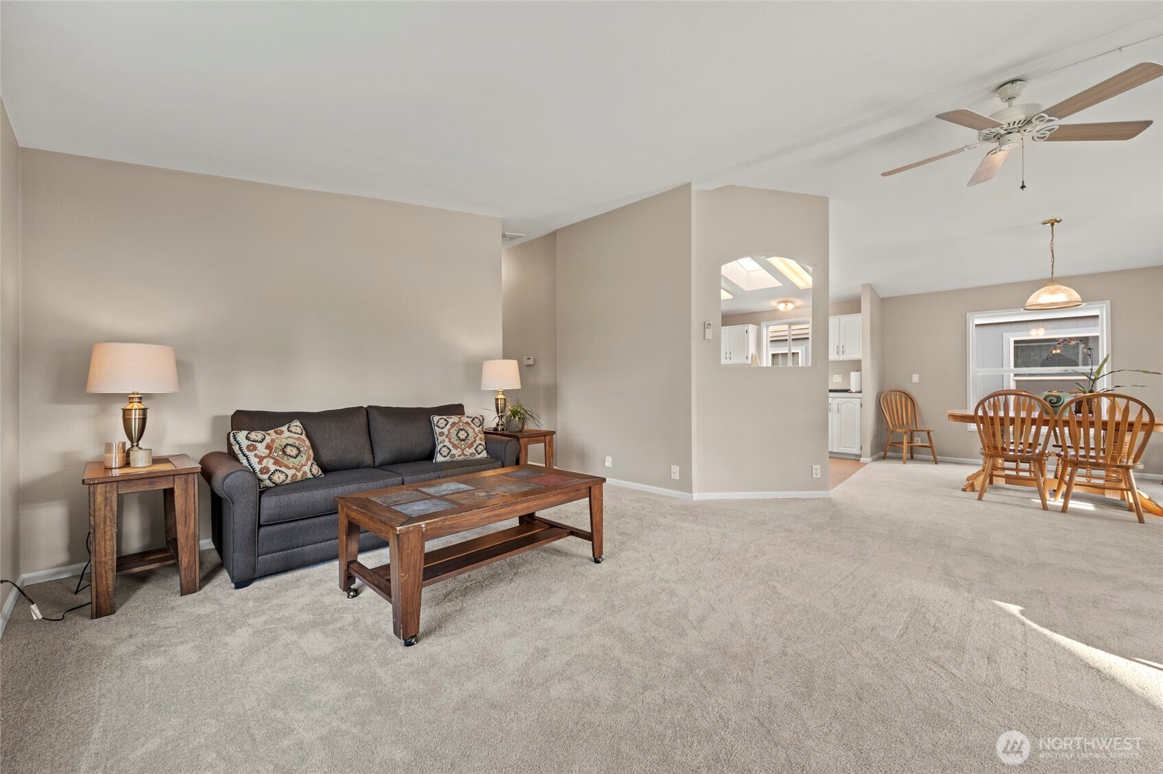 23825 15th Avenue Southeast, Unit 108 Bothell, WA 98021 - Photo 5 of 39 a living room with furniture and a table