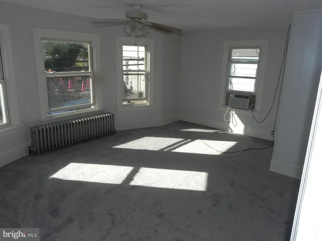 an empty room with windows