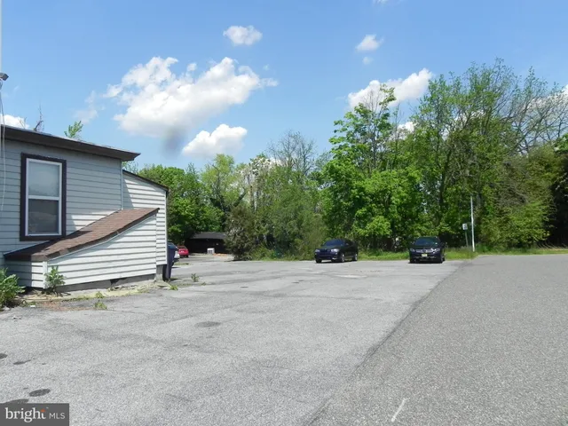 a bathroom with a sink a mirror and a window