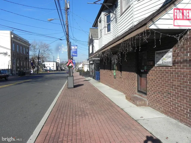 a view of a pathway with a building in the background