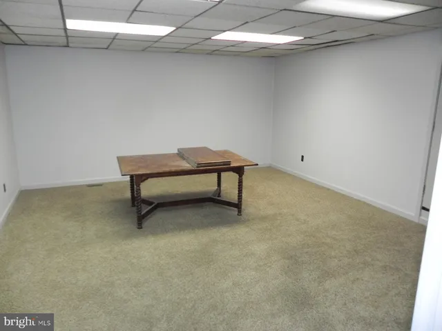 a view of a room with wooden walls