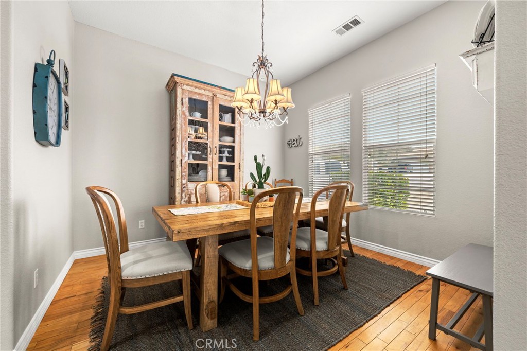 34423 Desert Road Acton, CA 93510 - Photo 13 of 53 a view of a dining room with furniture window and wooden floor