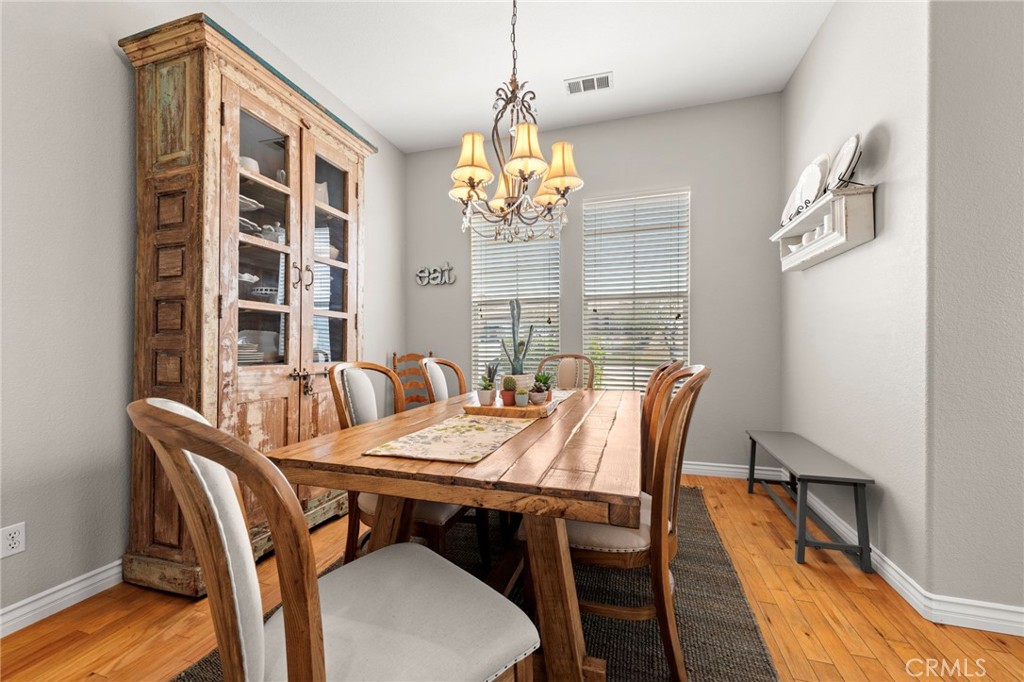 34423 Desert Road Acton, CA 93510 - Photo 14 of 53 a view of a dining room with furniture window and wooden floor