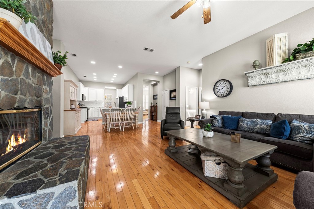 34423 Desert Road Acton, CA 93510 - Photo 23 of 53 a living room with furniture a wooden floor and a fireplace