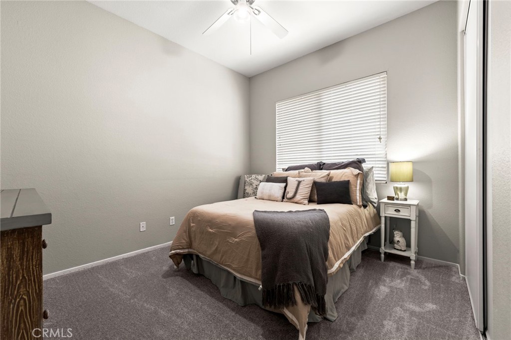 34423 Desert Road Acton, CA 93510 - Photo 27 of 53 a bedroom with a bed and a chandelier