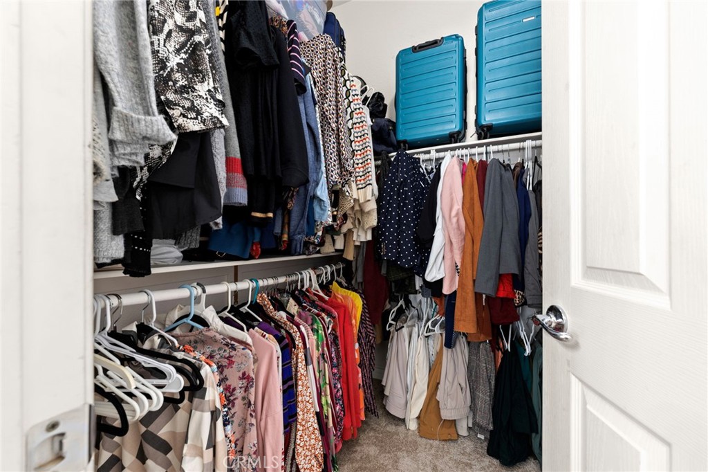 34423 Desert Road Acton, CA 93510 - Photo 37 of 53 a view of walk in closet with clothes and shoes