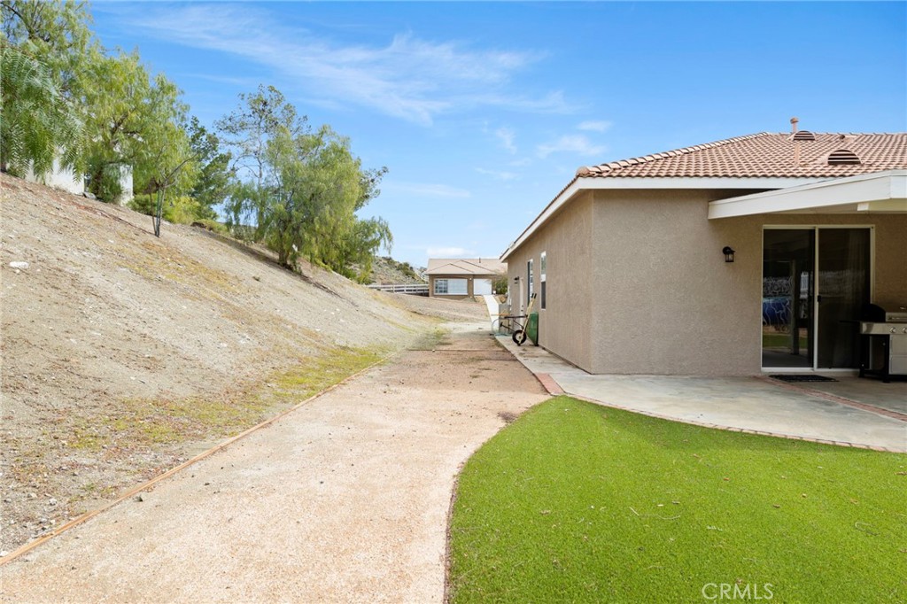34423 Desert Road Acton, CA 93510 - Photo 45 of 53 a view of a house with a backyard