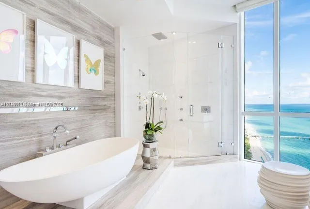 a bathroom with a bathtub and a sink