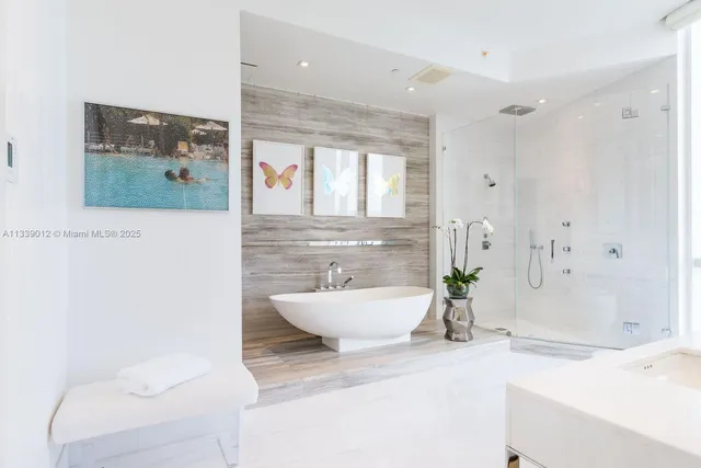 a spacious bathroom with a bathtub and sink