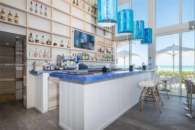 a kitchen view with dining table chairs and chandelier