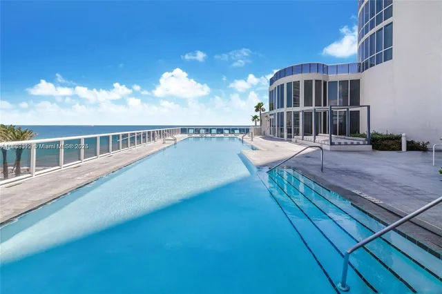 a view of a balcony with wooden floor