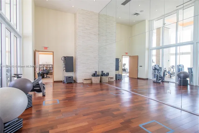 a living room with furniture window and wooden floor