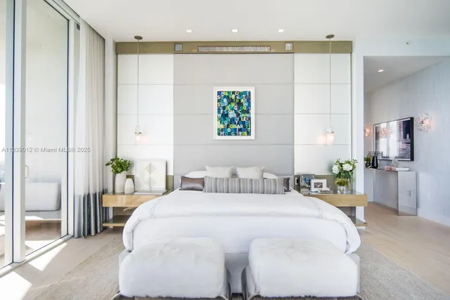 a bedroom with a bed and a painting