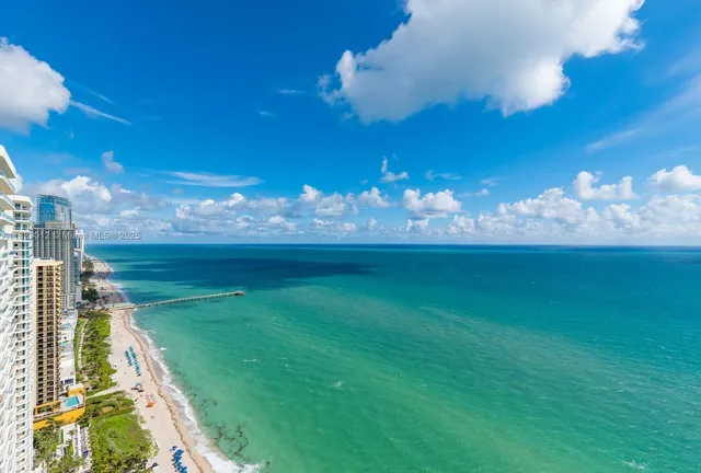 a view of a golf course with a swimming pool