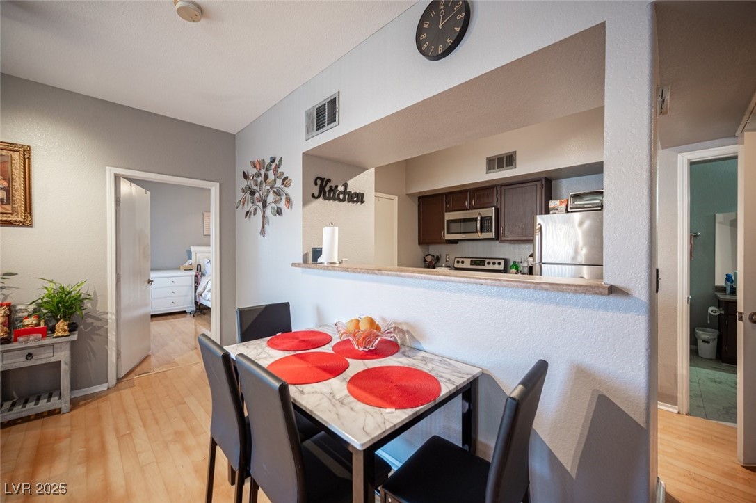 6650 West Warm Springs Road, Unit 1079 Las Vegas, NV 89118 - Photo 12 of 37 Dining area with visible vents and light wood-style flooring