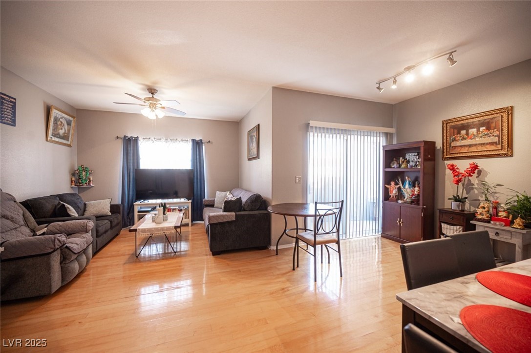6650 West Warm Springs Road, Unit 1079 Las Vegas, NV 89118 - Photo 13 of 37 Living area with ceiling fan and light wood finished floors