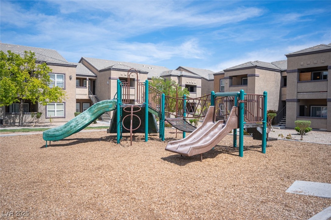 6650 West Warm Springs Road, Unit 1079 Las Vegas, NV 89118 - Photo 34 of 37 Community jungle gym with a residential view