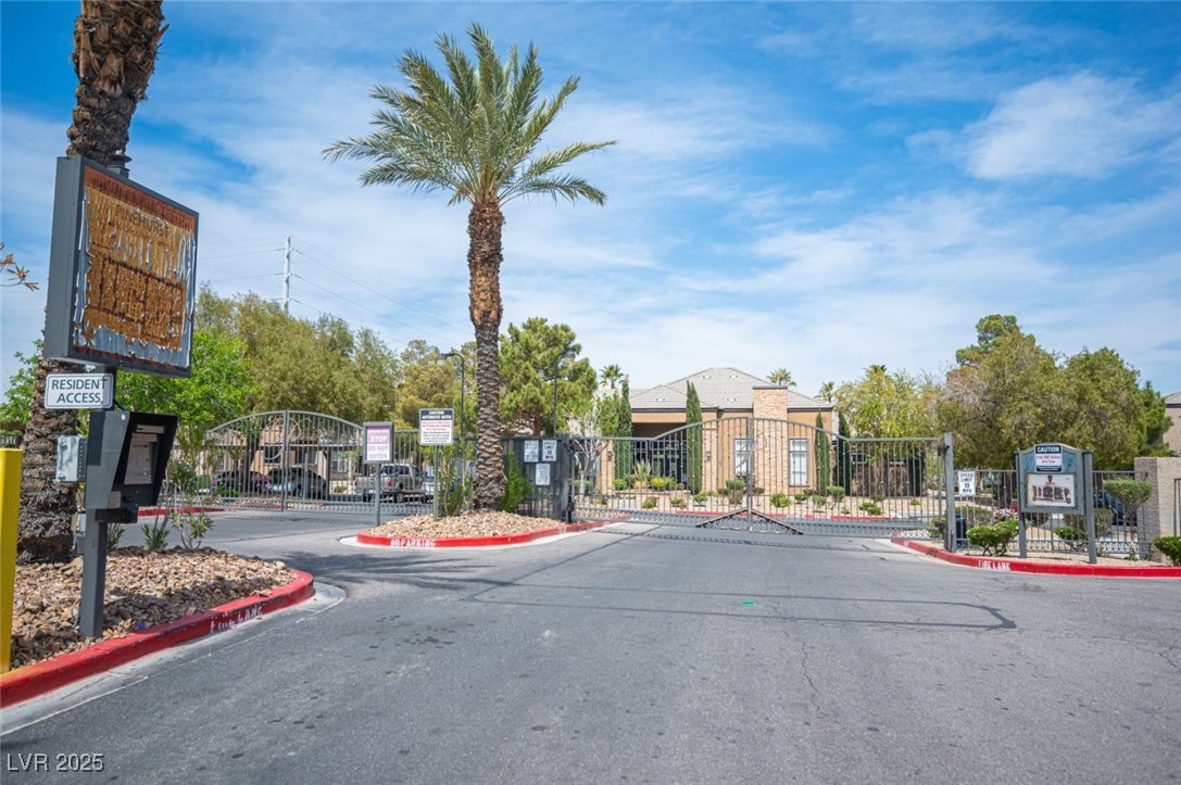 6650 West Warm Springs Road, Unit 1079 Las Vegas, NV 89118 - Photo 37 of 37 View of street featuring a gated entry, curbs, and a gate